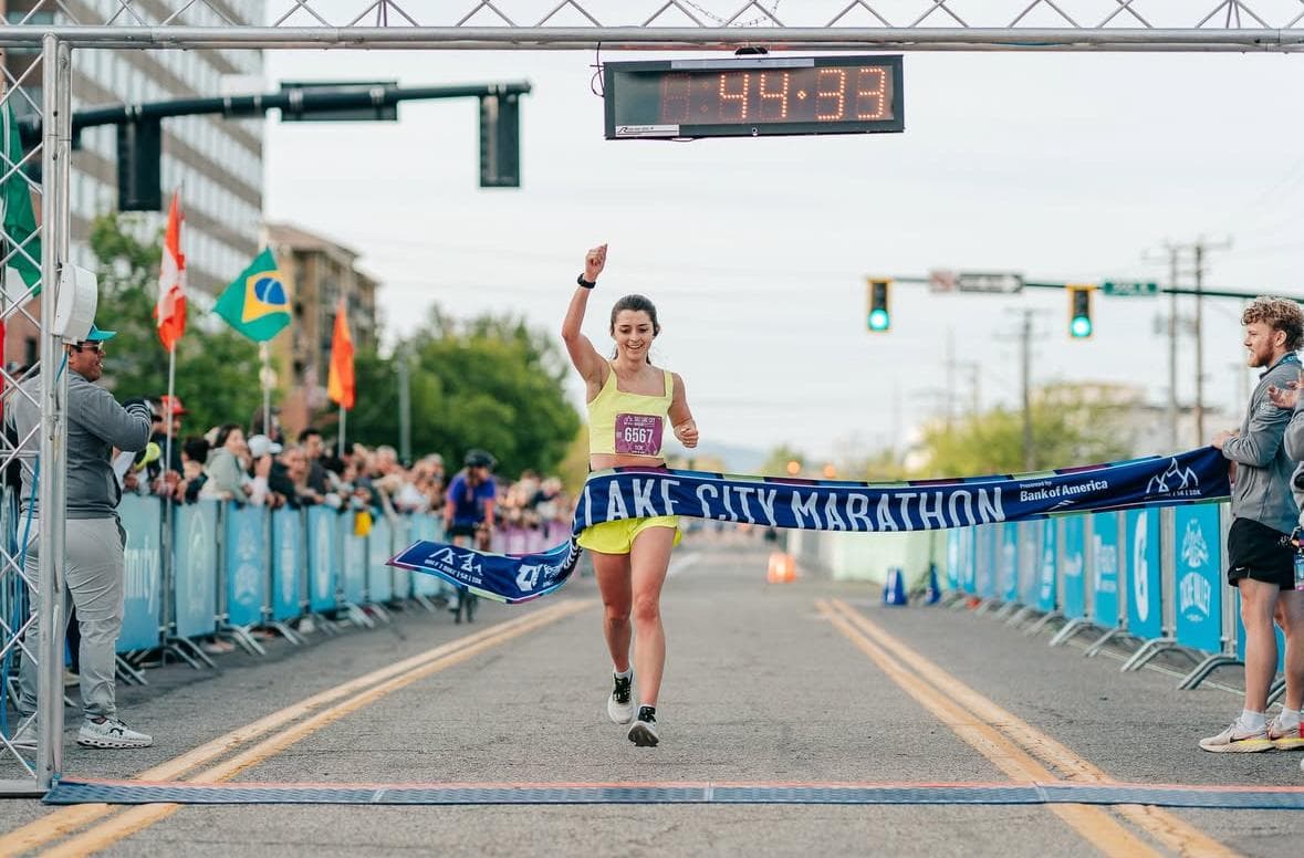 Tatum breaking the finish tape at the Salt Lake City Marathon
